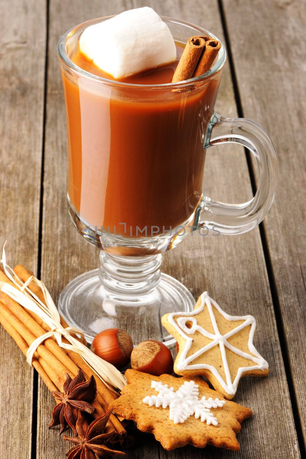 Glass of hot chocolate on wooden table