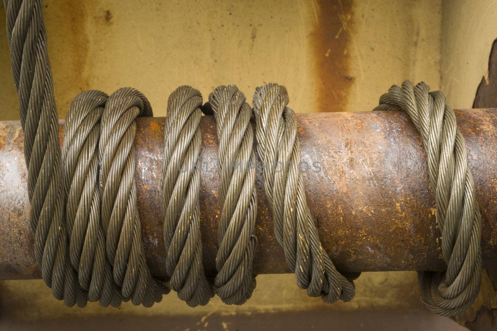 A cable designed to hold freight on a railcar