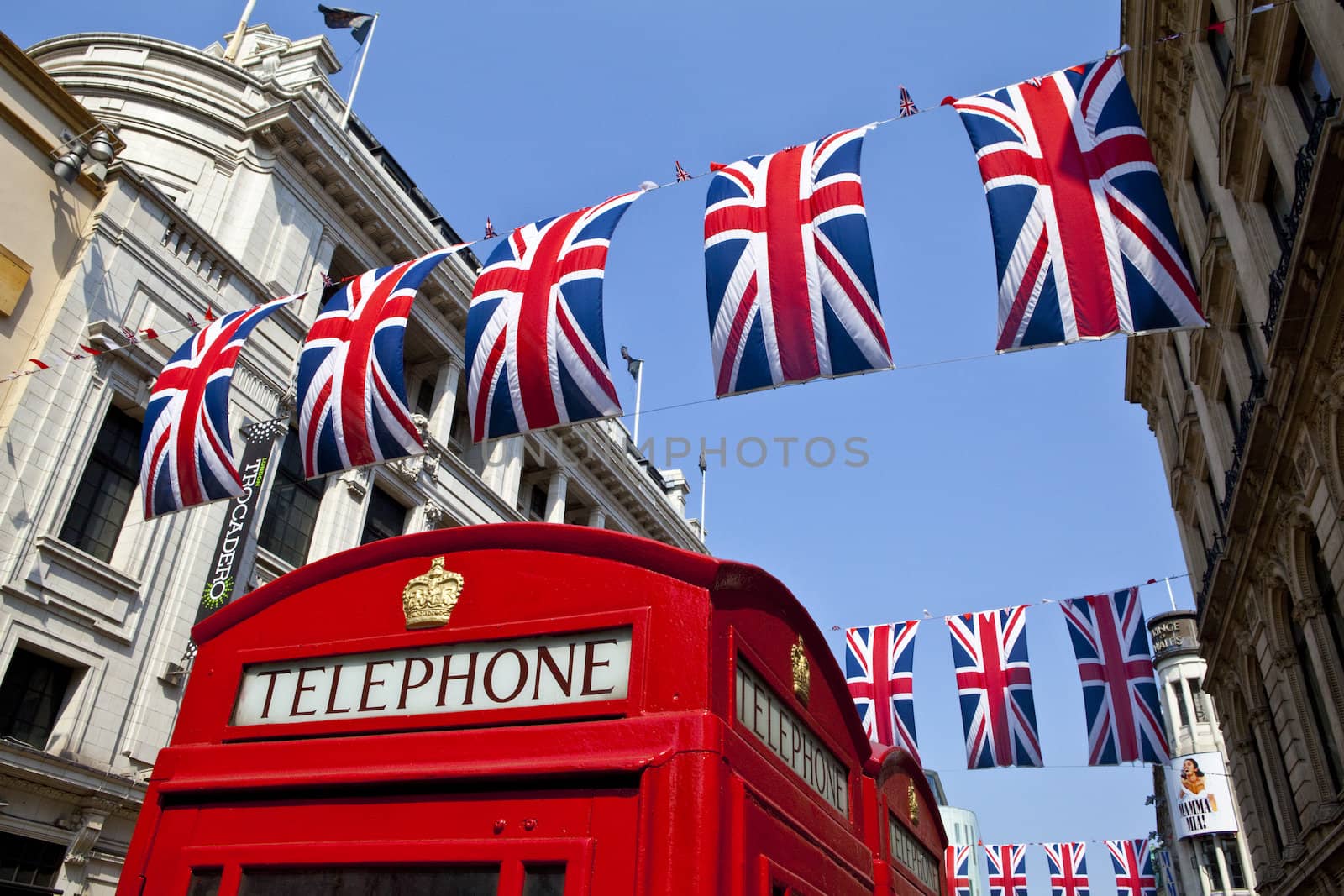 Telephone Box and Union Flags in London by chrisdorney