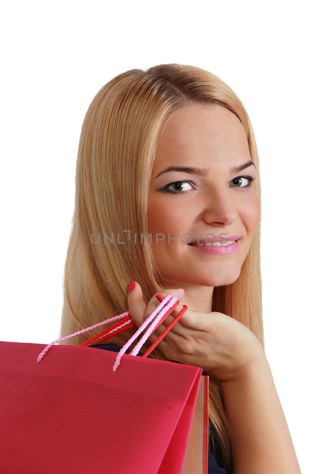 Beuaitufl young blonde woman with a shopping bags over her shoulder.