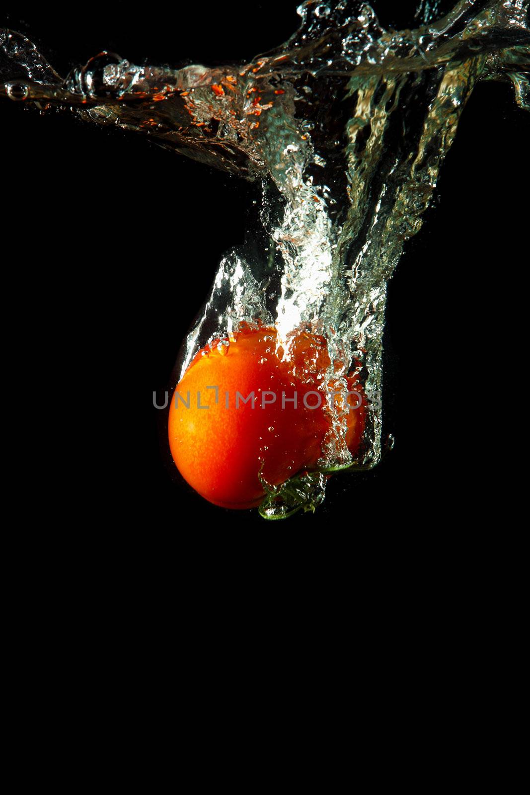 fresh tomato under water by sergey_nivens