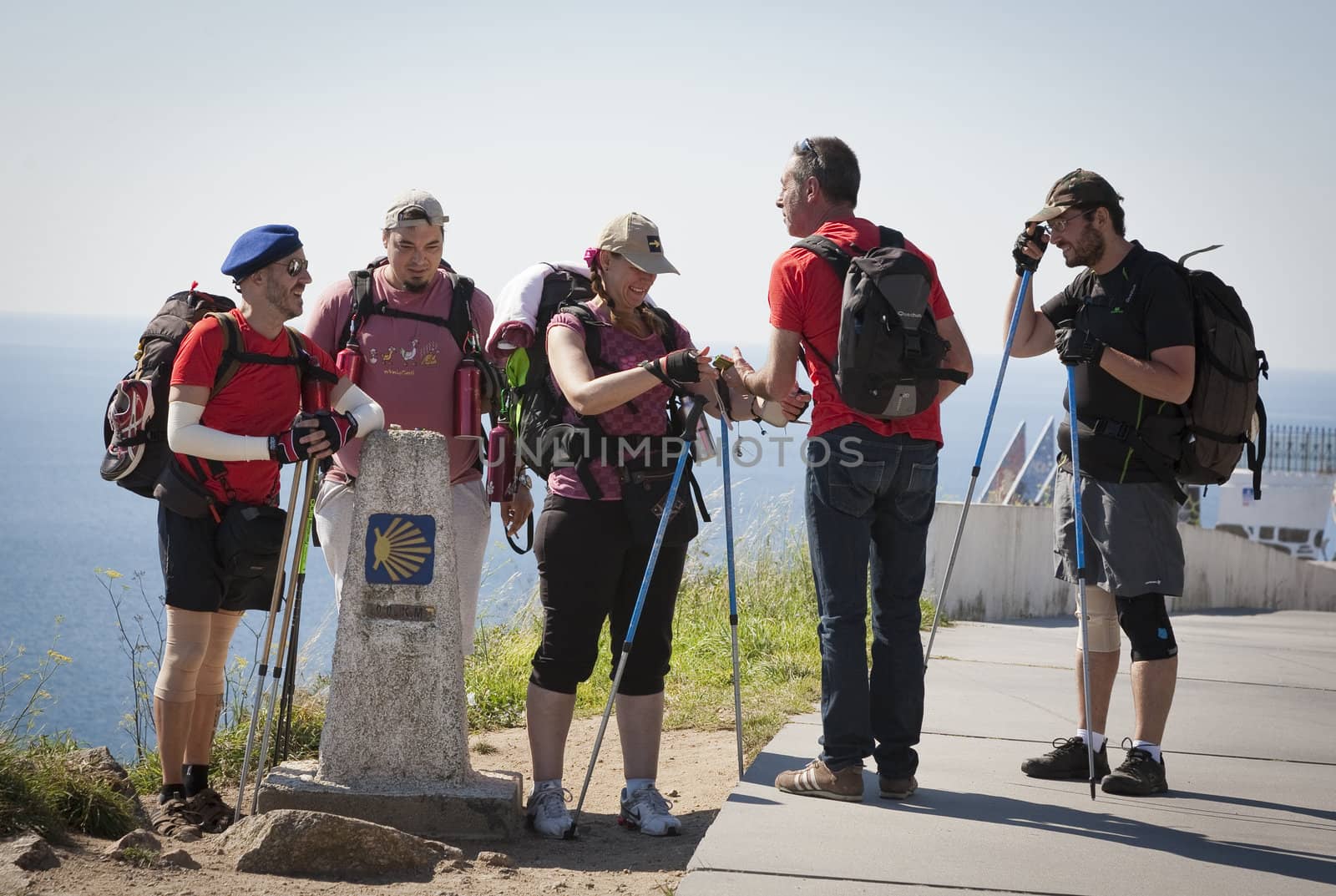 FINISTERE, SPAIN – SEPTEMBER 3:  Unidentified pilgrims at the end of their Camino de Santiago walk on September 3, 2012. Here they burn their clothes and boots and throw the ashes into the sea.