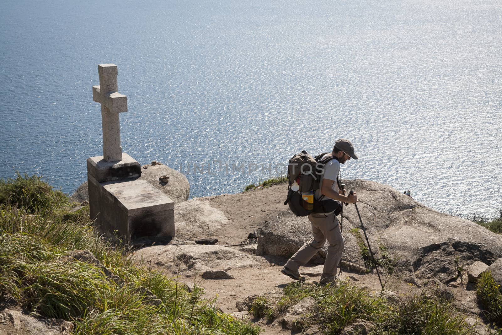 FINISTERE, SPAIN – SEPTEMBER 4:  Unidentified pilgrim at the end of his Camino de Santiago walk on September 4, 2012. Here he will burn his clothes and boots and throw the ashes into the sea.