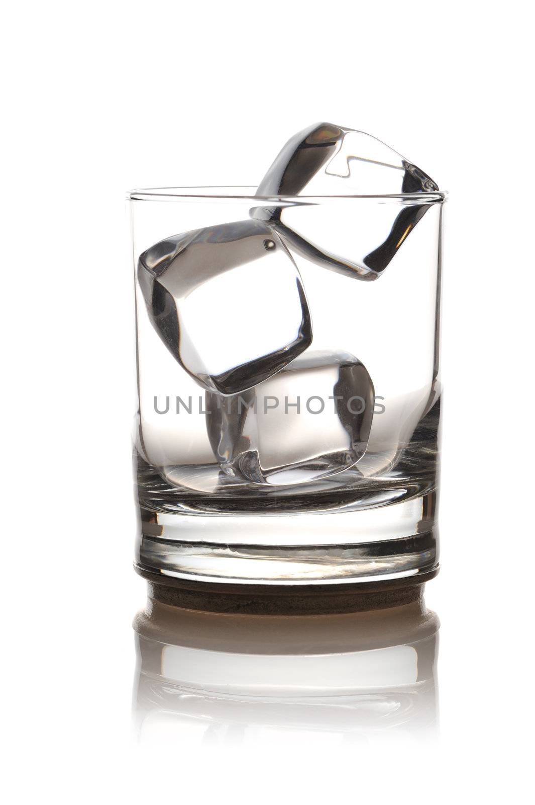 Glass with ice isolated on white background