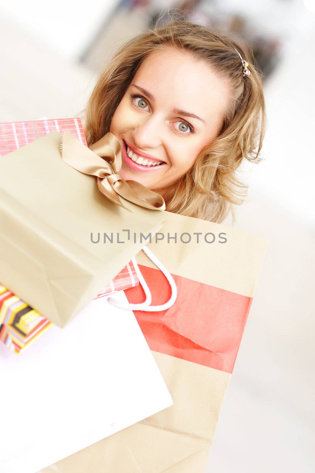 Woman with bags in shopping mall