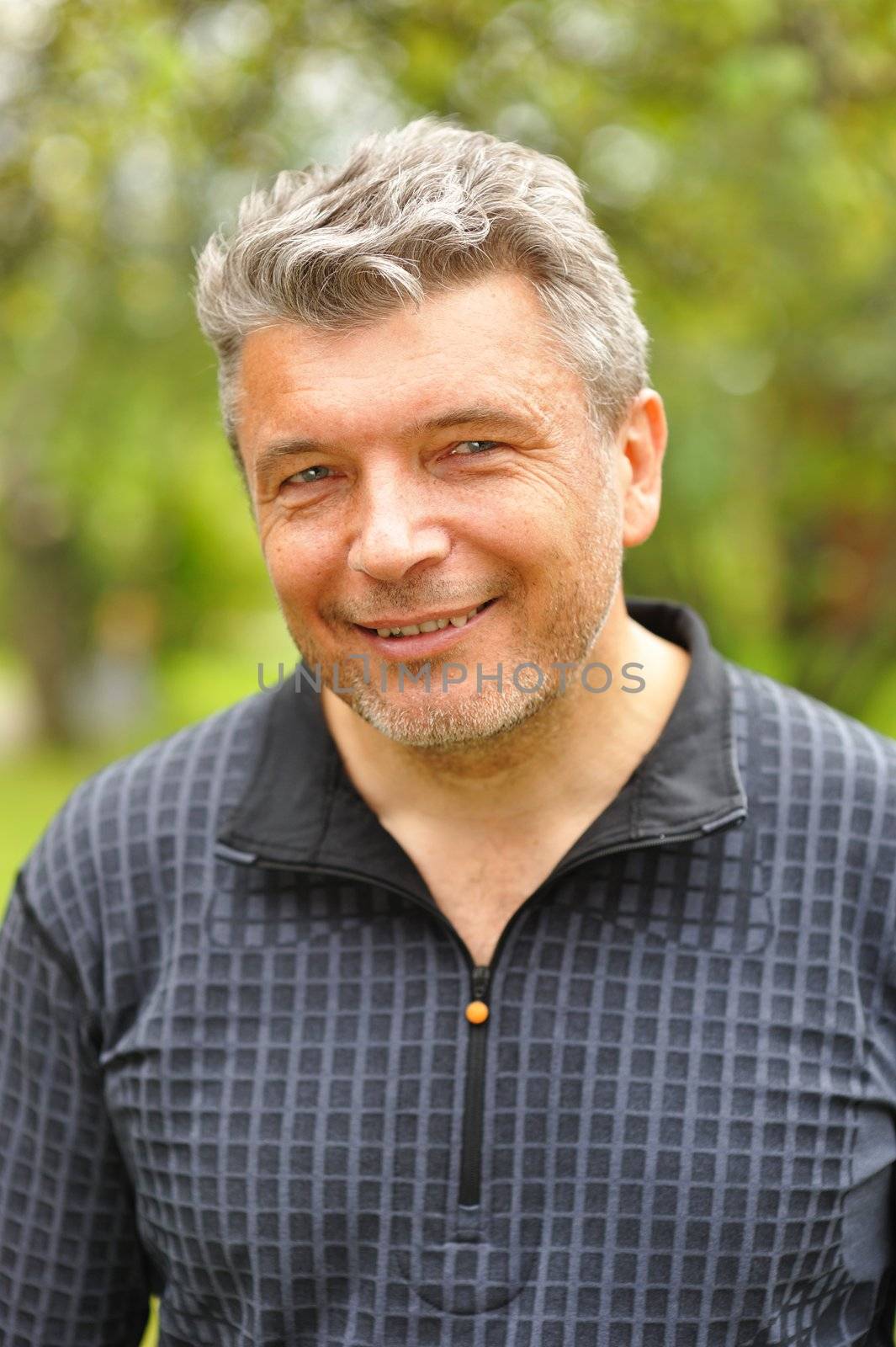 Happy mature man smiling outdoors