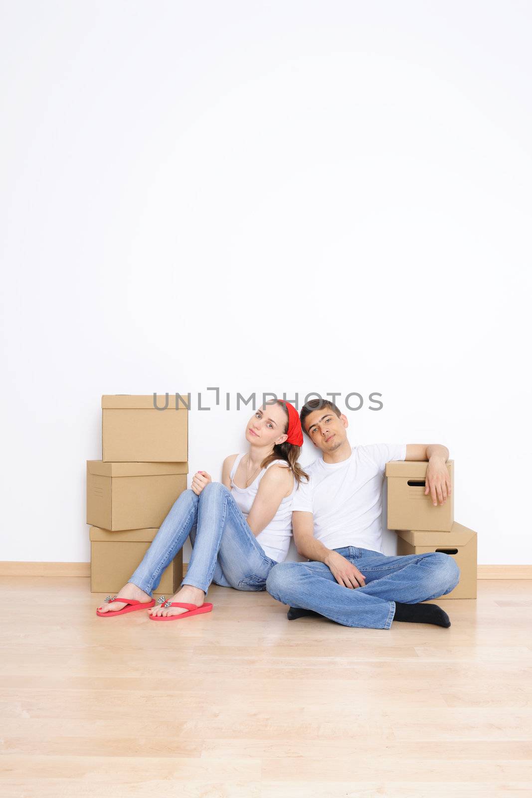 Young couple resting from moving into a new home