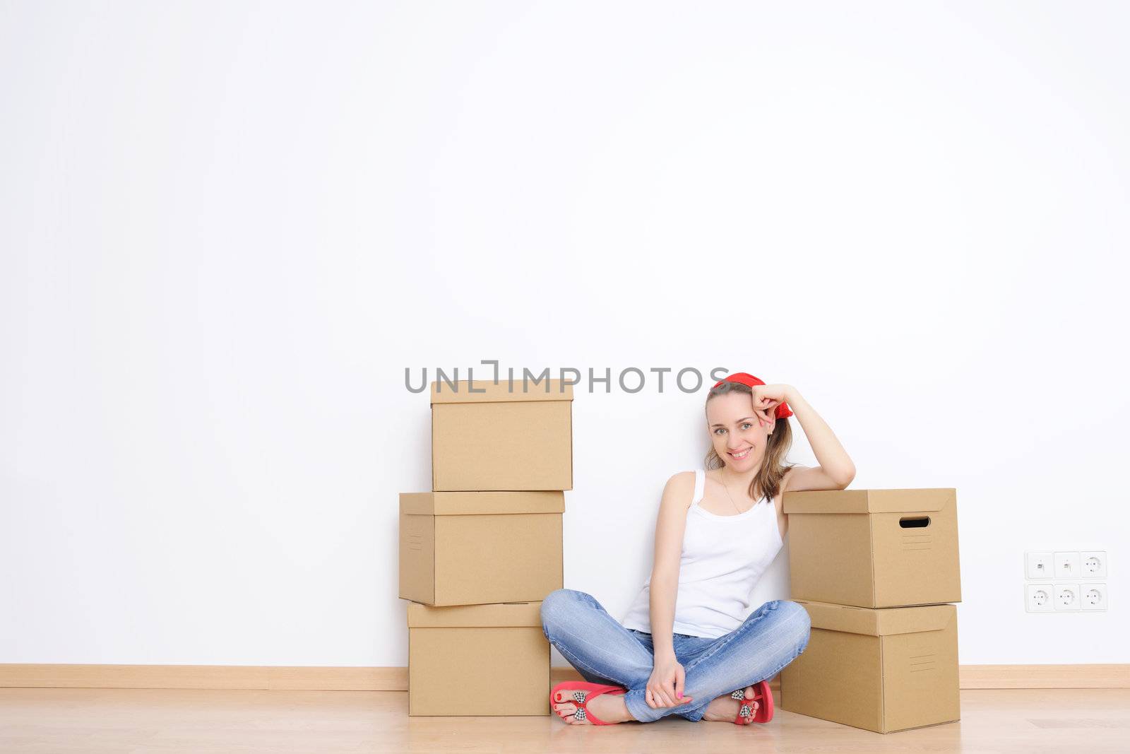 Woman resting from moving into a new home