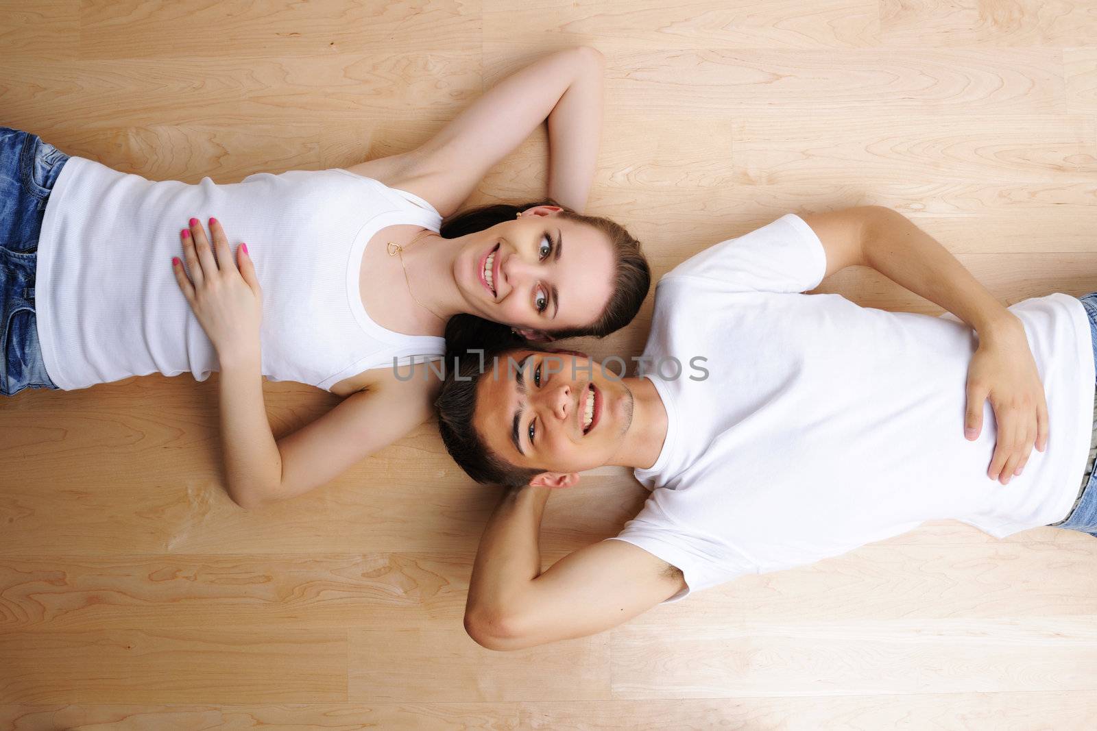 Young couple resting from moving into a new home