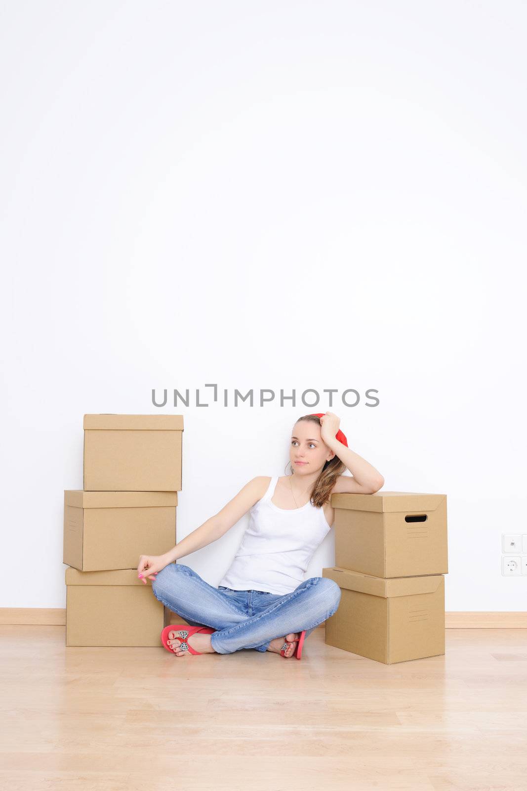 Woman resting from moving into a new home