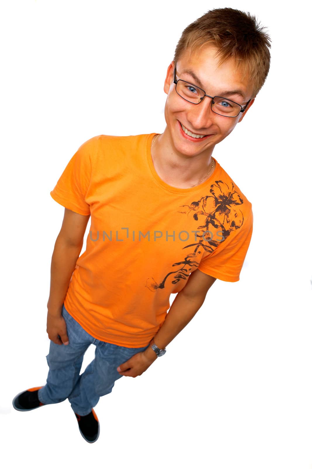 Full length of a happy young guy standing on white

