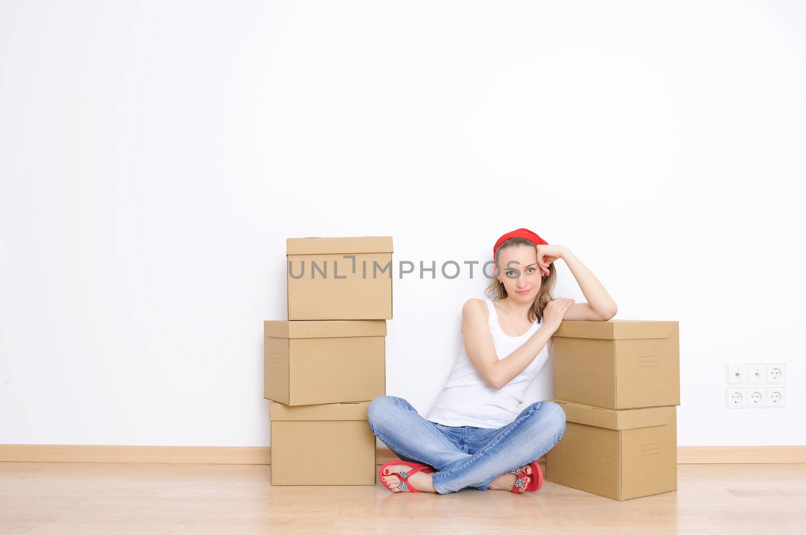 Woman resting from moving into a new home 