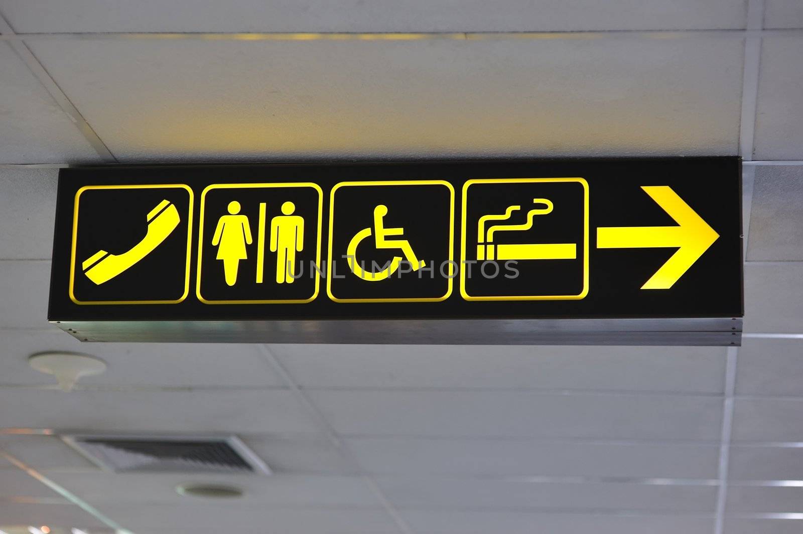 Airport toilet signs, yellow on black