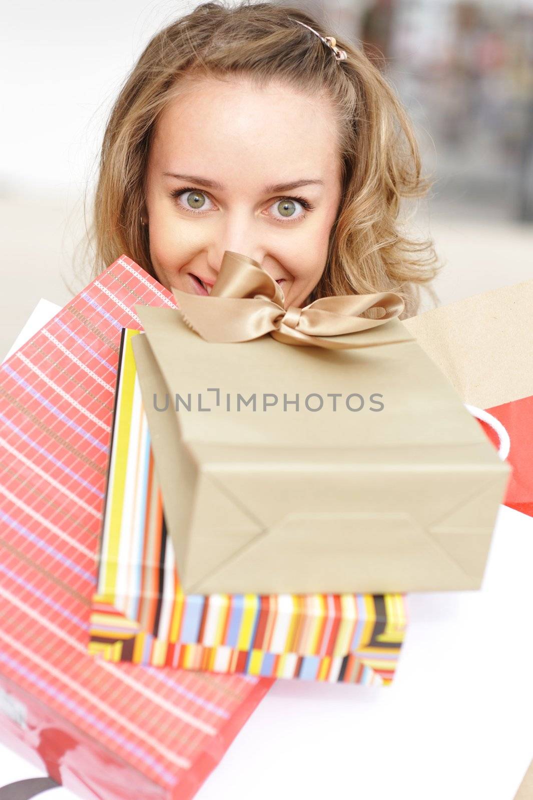 Woman with bags in shopping mall