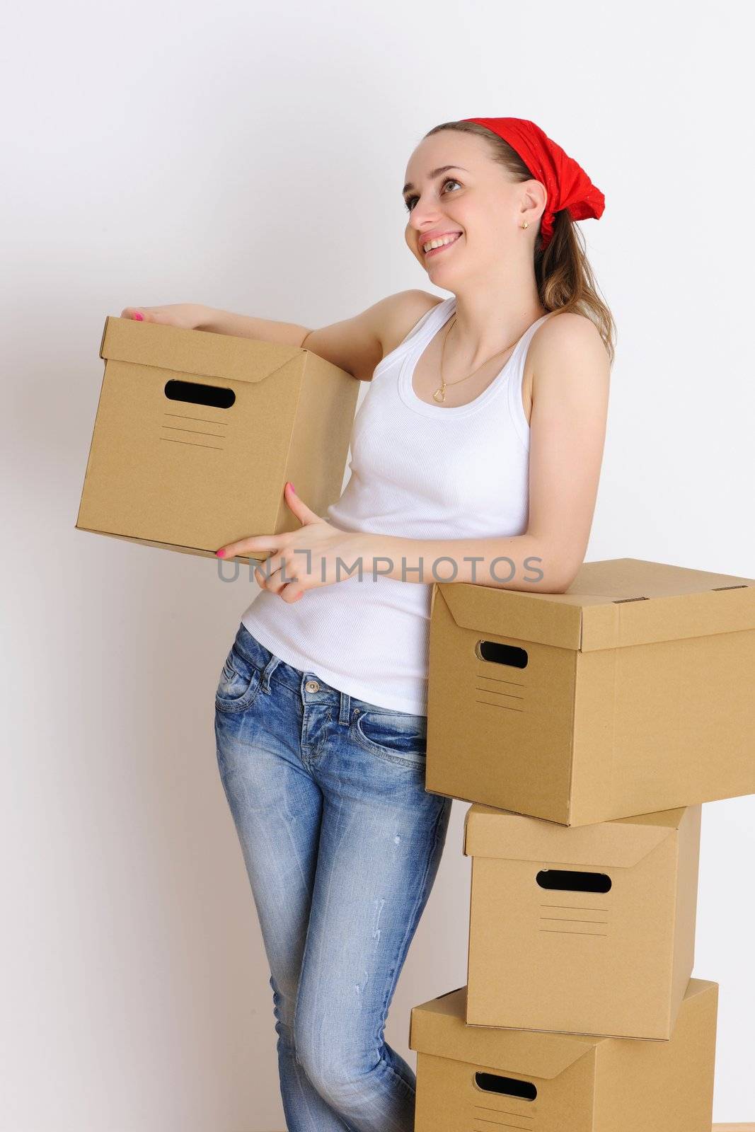 Young woman with a stack of boxes