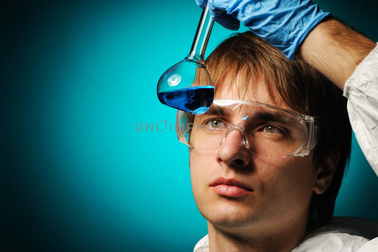 Scientist in protective wear and glasses 