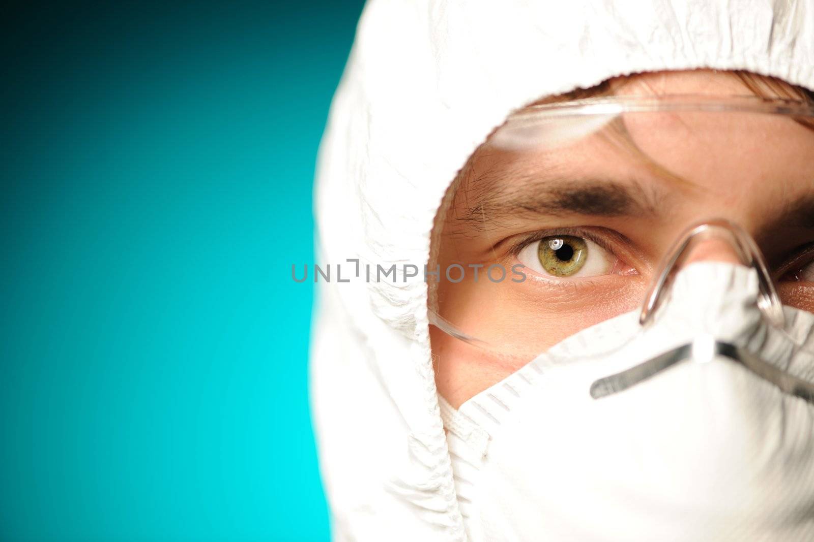 Scientist in protective wear, glasses and respirator 