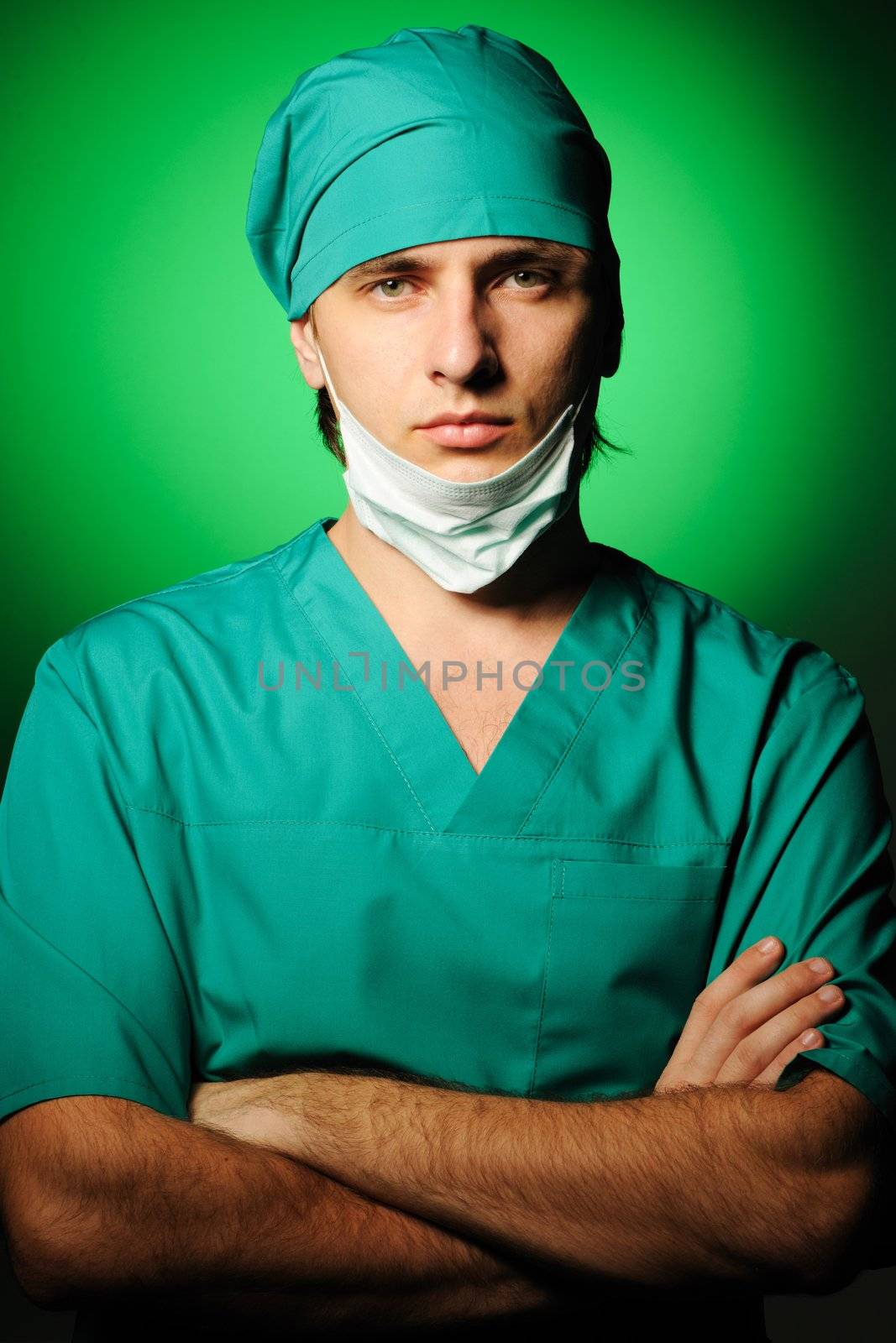 Surgeon with mask over green