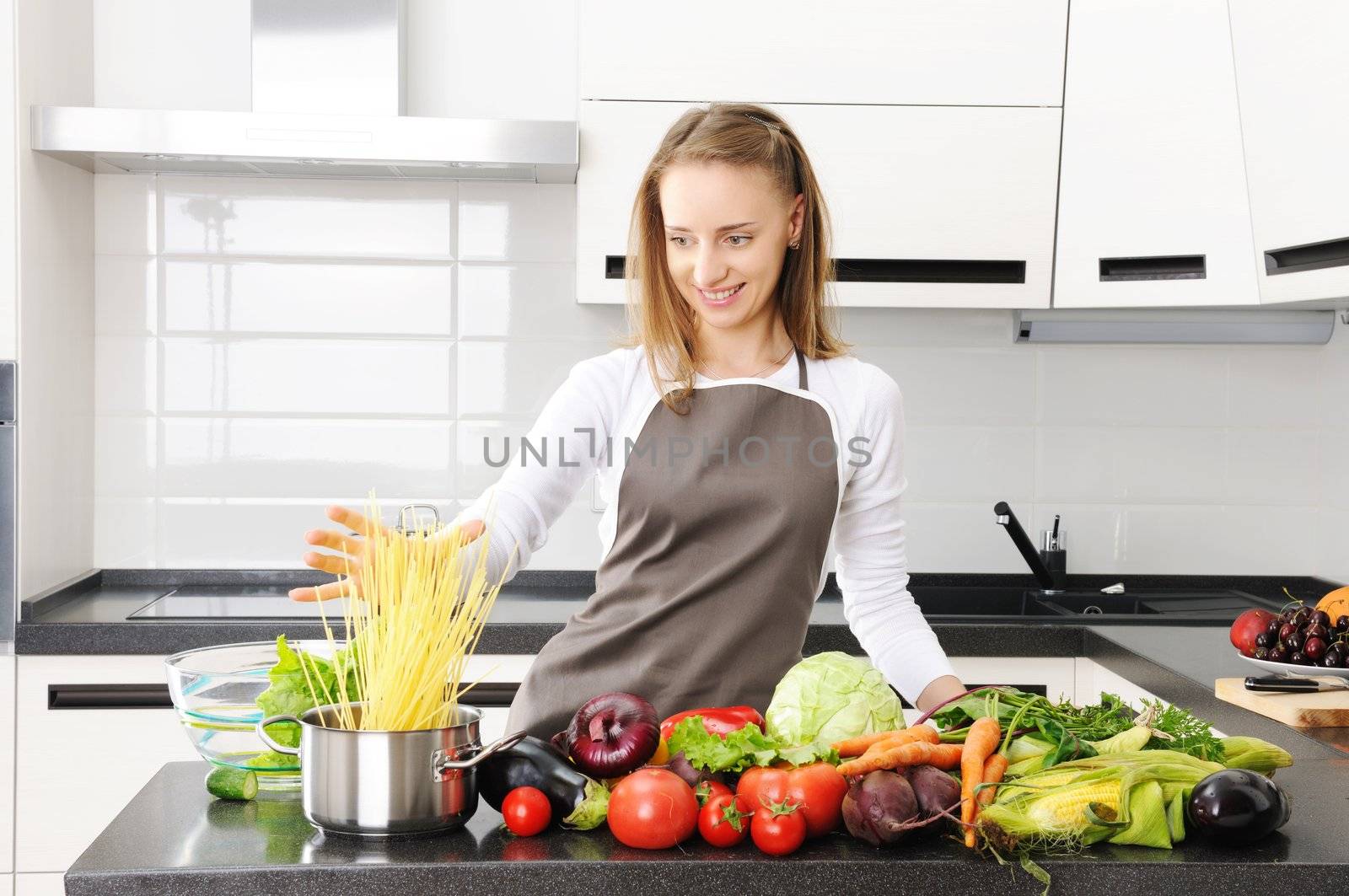 Woman cooking in modern kitchen