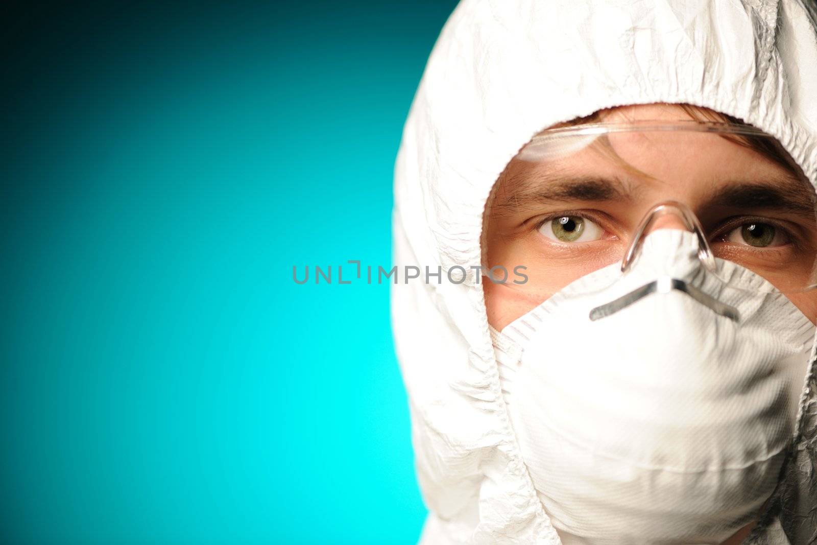 Scientist in protective wear, glasses and respirator 