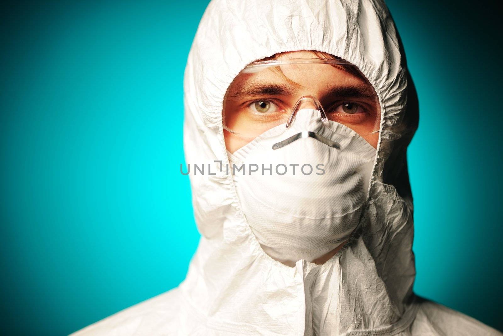 Scientist in protective wear, glasses and respirator 