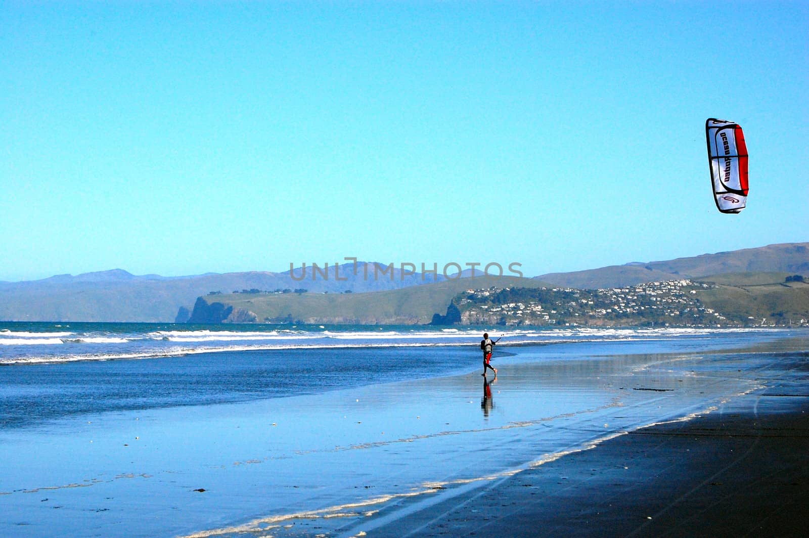 Man training with kite on the beach, Christchurch, New Zealand