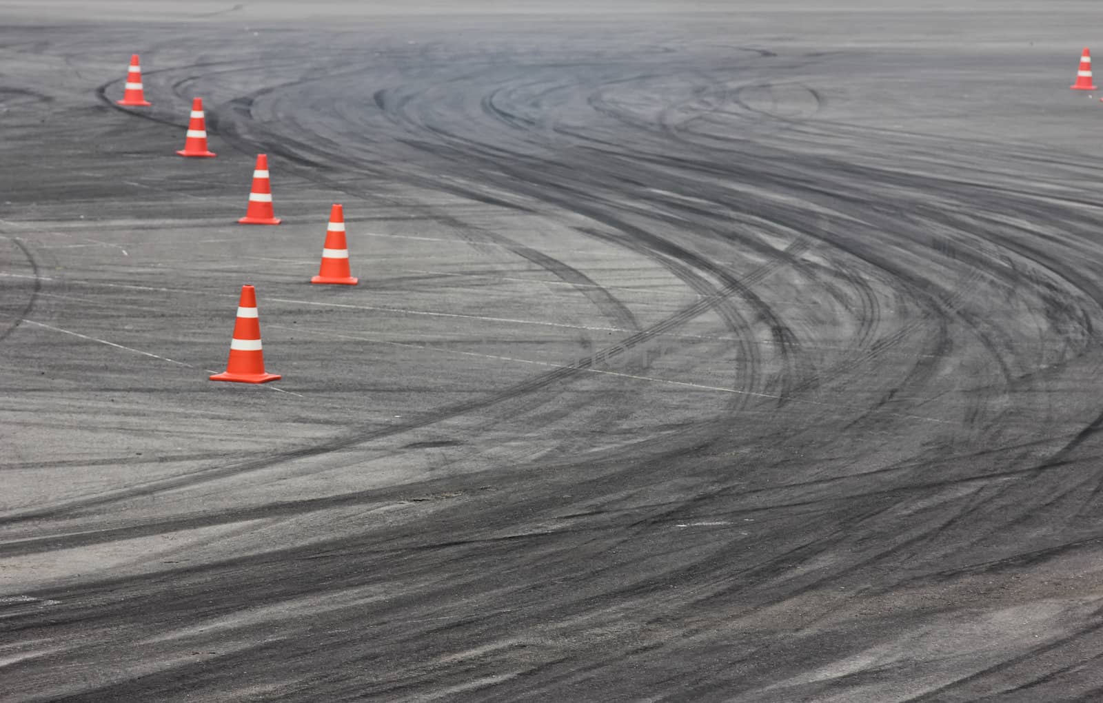 Background with traffic cone on road track