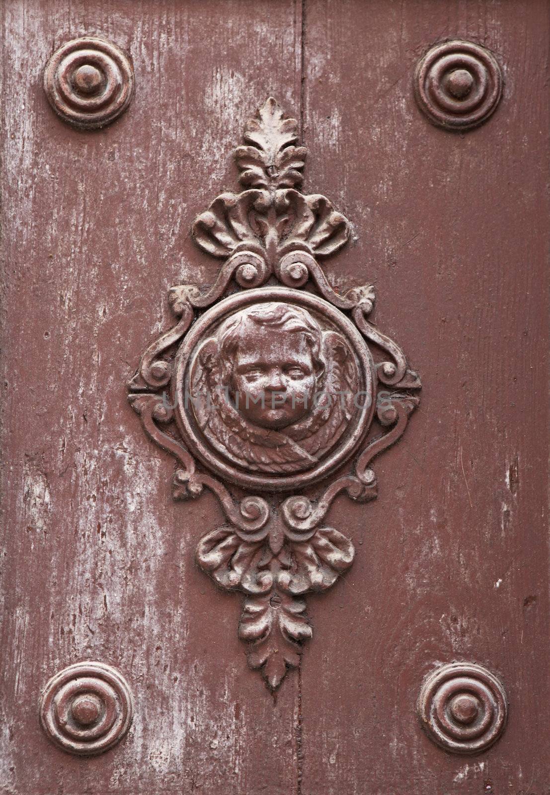 Wooden ornament on a historic church door in Zadar, Croatia