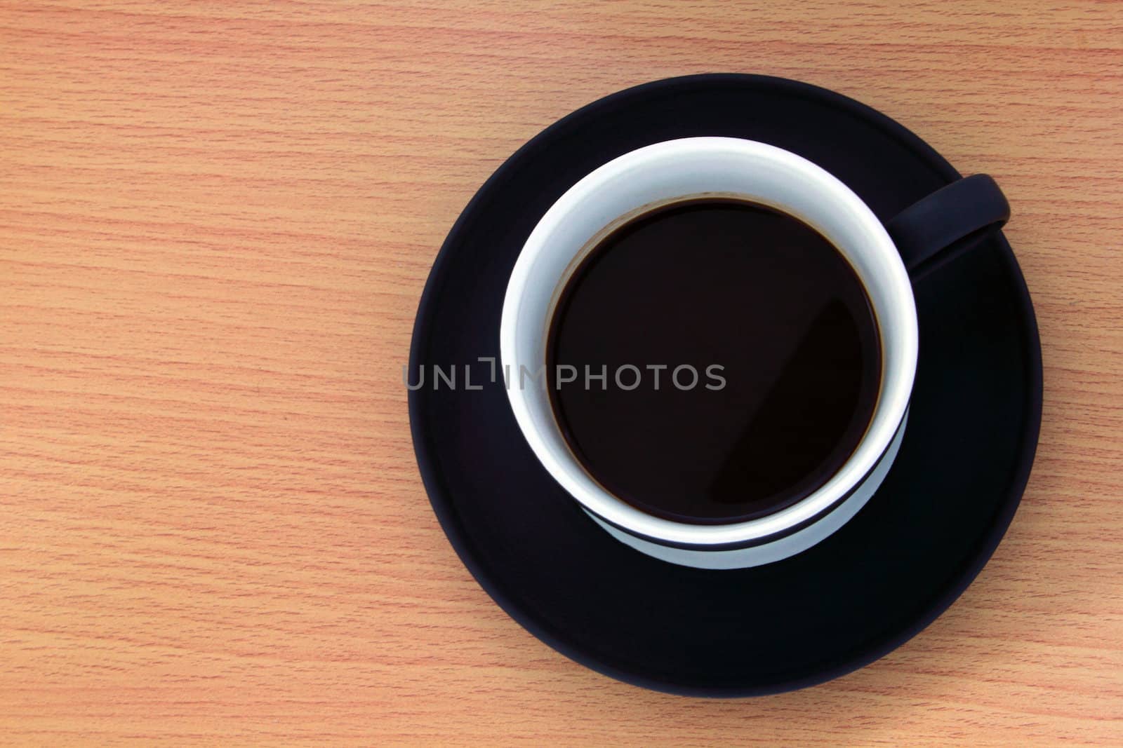 Coffee cup on wood background