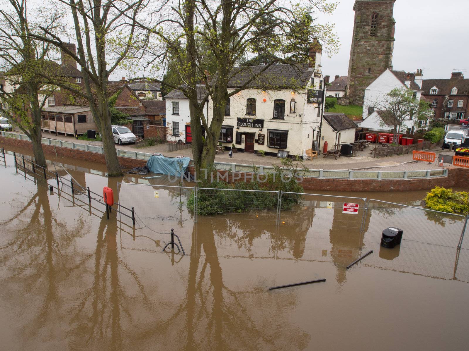 Upton Upon Severn, Worcestershire, UK on Wednesday 2nd May.  Pub saved by newly completed flood defenses being tested after recent record braking rainfall swells River Severn to bursting point.  Defenses are holding back the floodwater and protecting town.