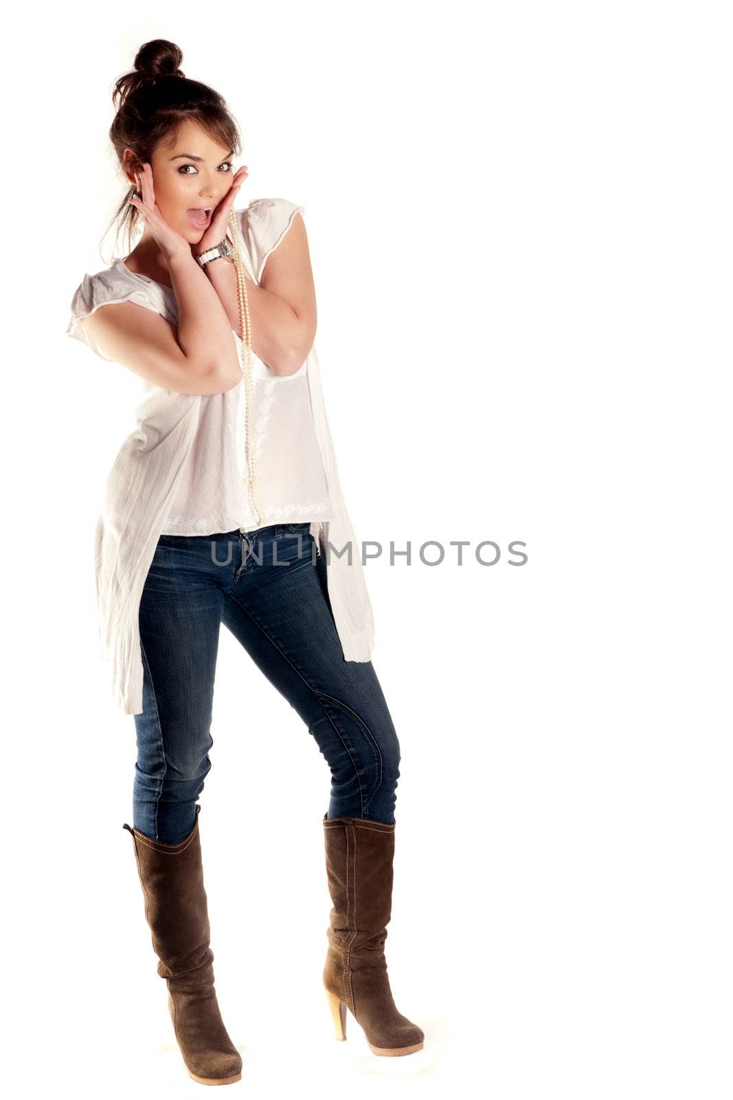 Beautiful young amazed expression in a studio isolaetd on white