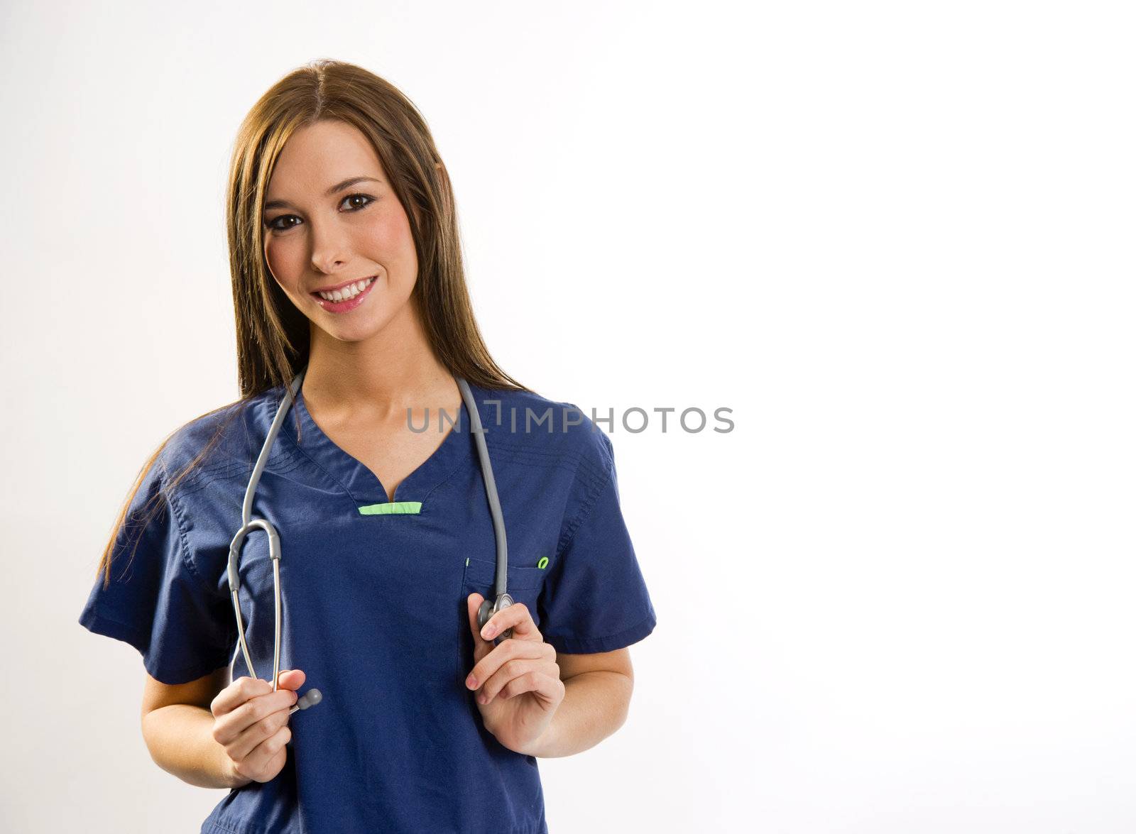 A beautiful health care worker looks up at the viewer from her work station