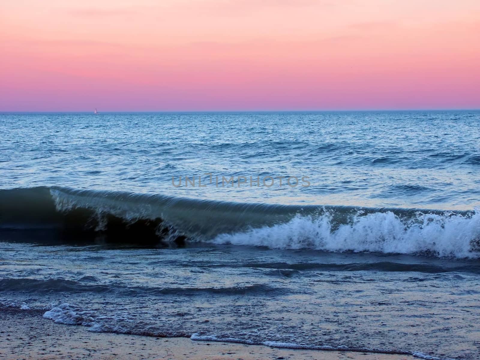 Waves under a beautiful Lake Michigan sunset at Illinois Beach State Park.