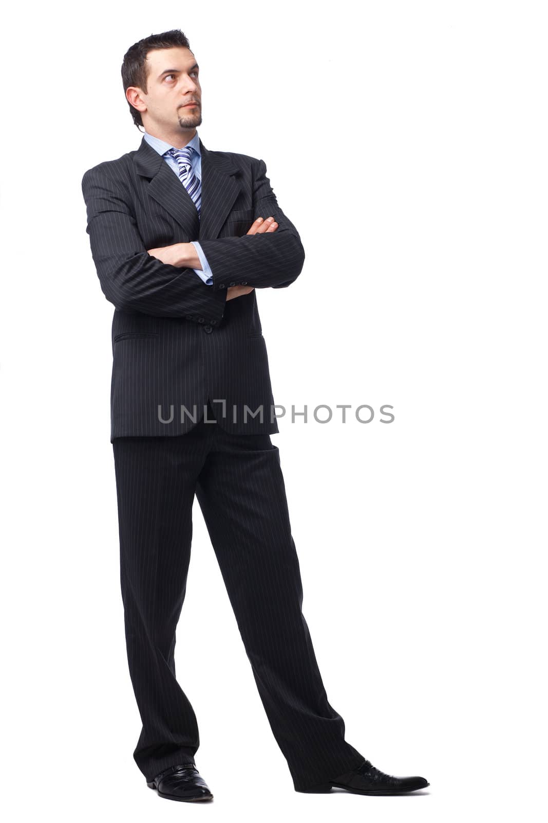 Portrait of a business man with hands folded looking away in a thought  on white 