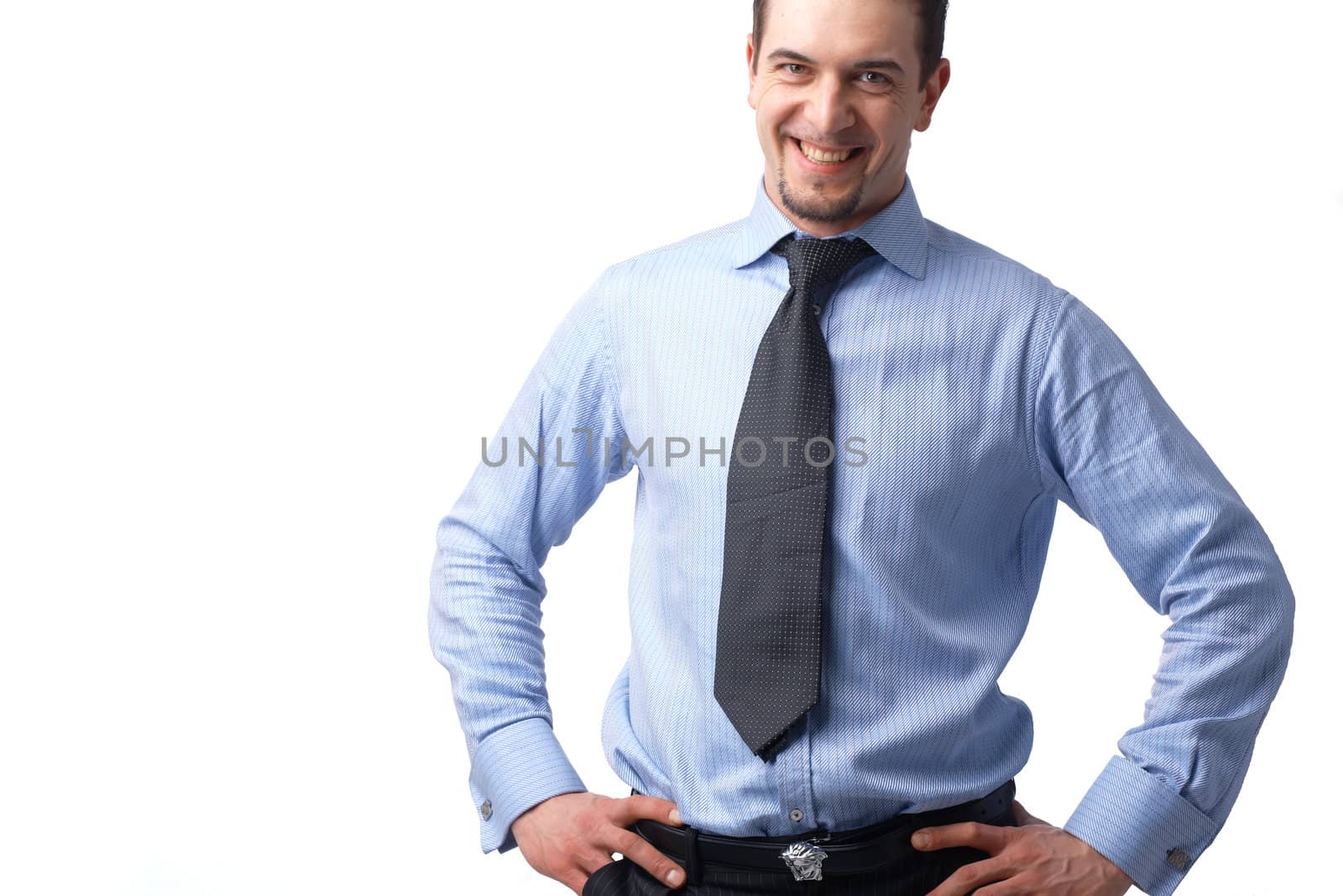   Portrait of successful businessman smiling over white background