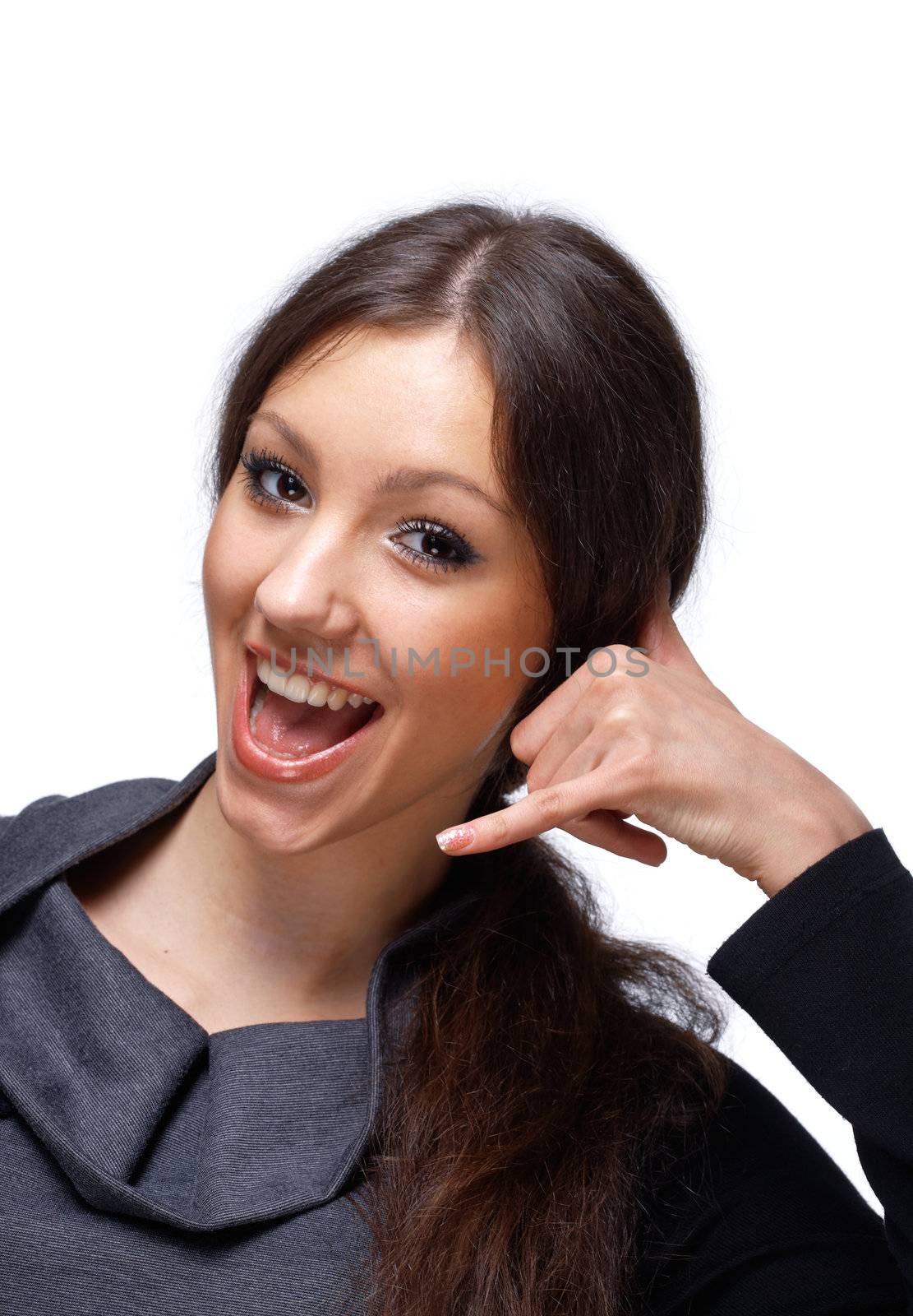 Portrait of a happy young female gesturing a call me sign isolated on white background.