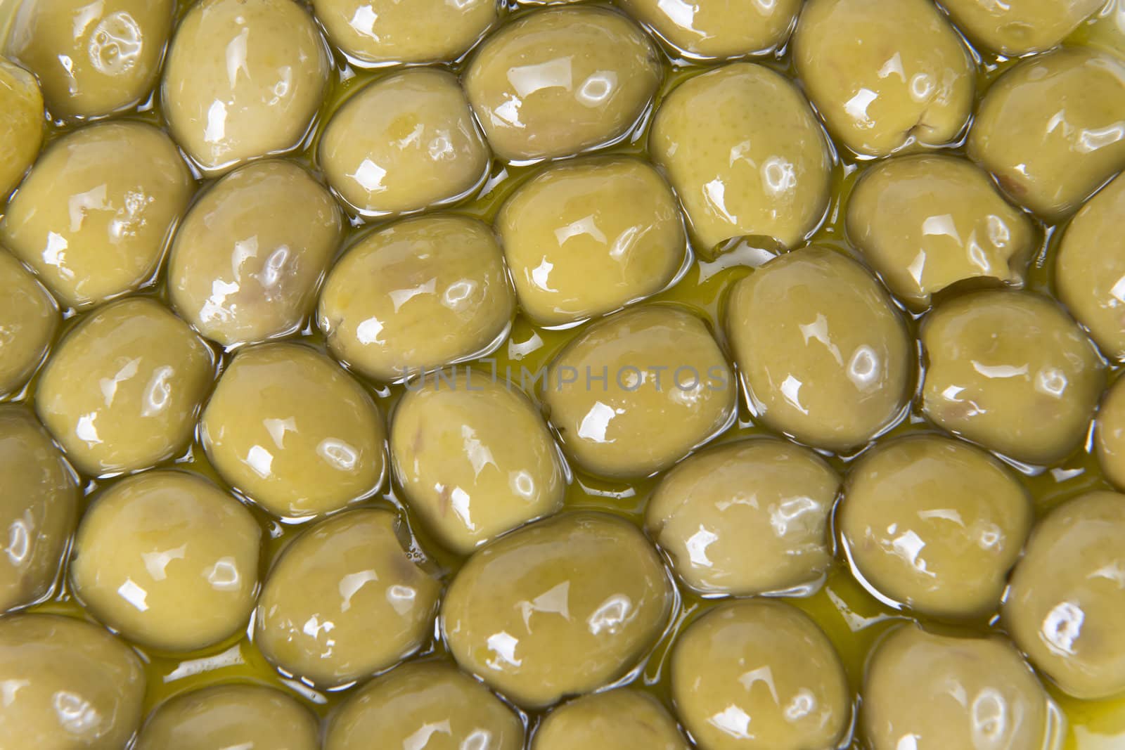 Pitted olives covered in oil by angelsimon