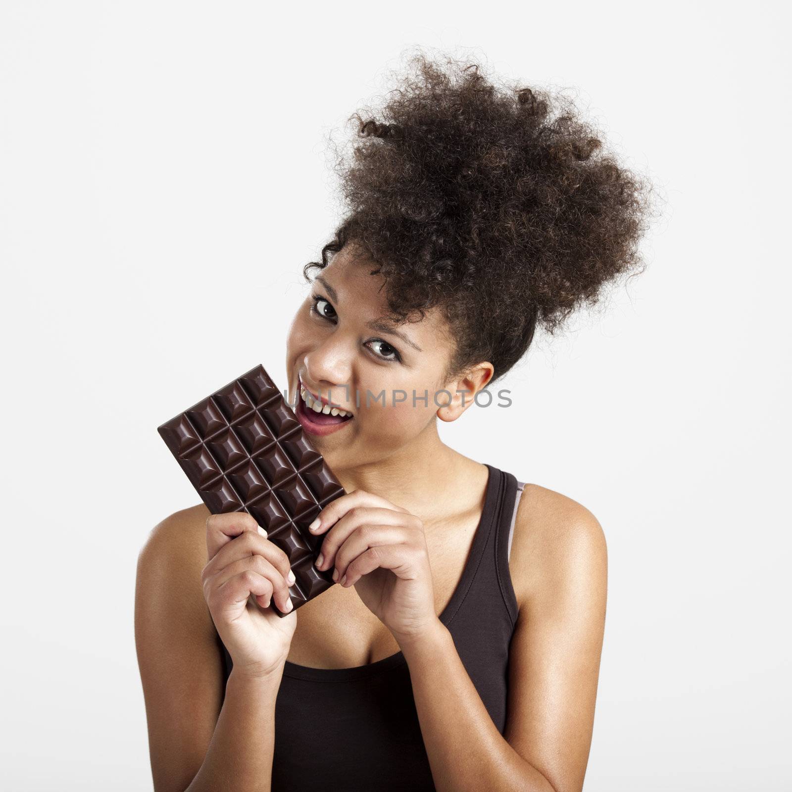 Woman eating chcolate by Iko