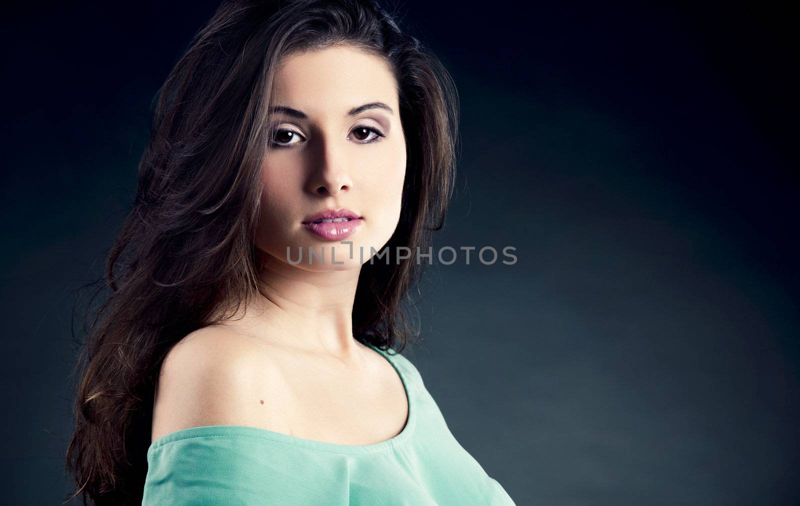 Studio portrait of a beautiful and atractive fashion woman posing