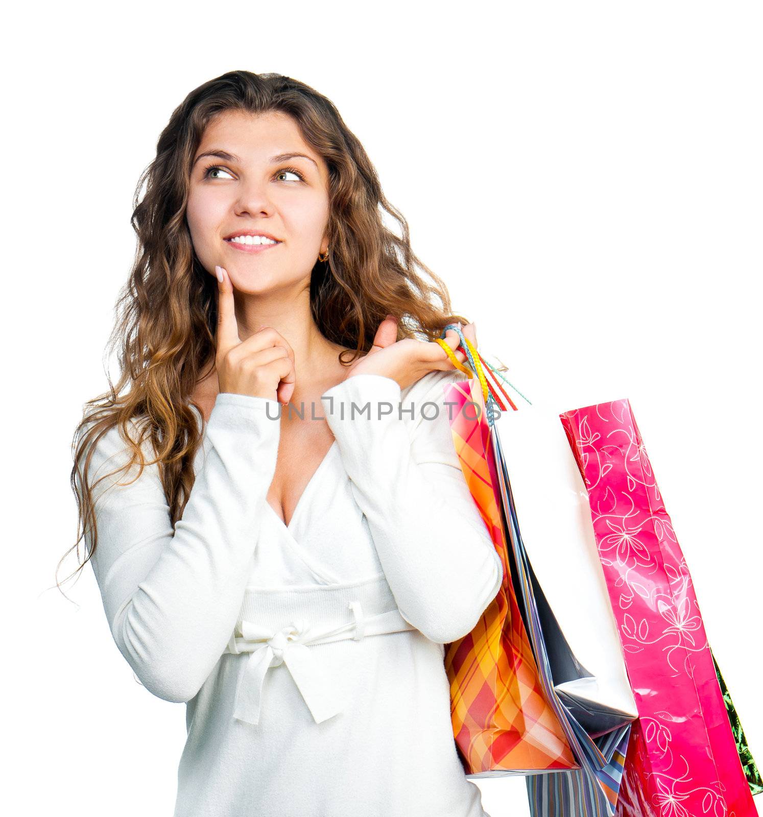 Female hand holding colorful shopping bags looks up