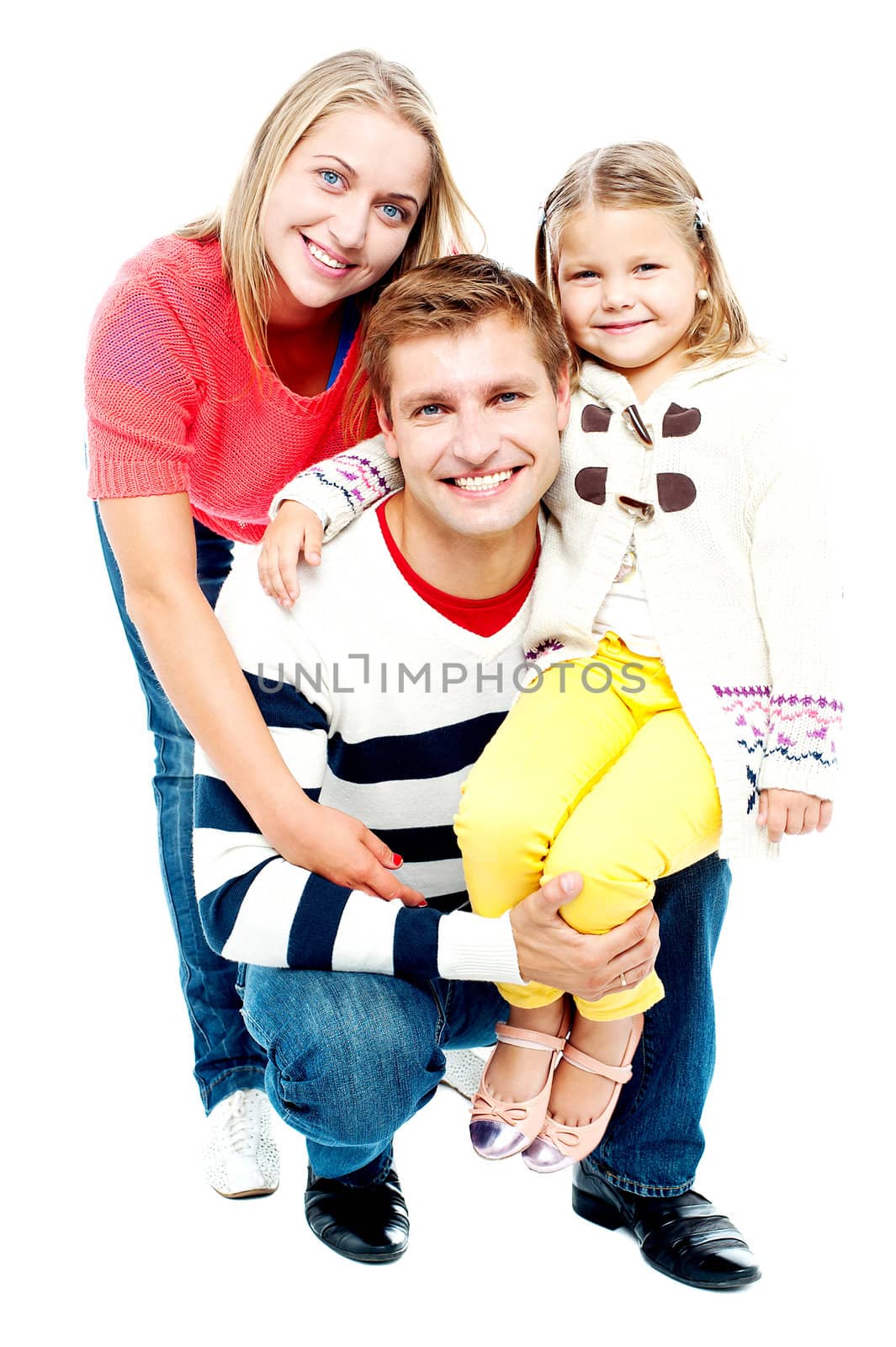 Portrait of happy parents with their daughter looking at camera