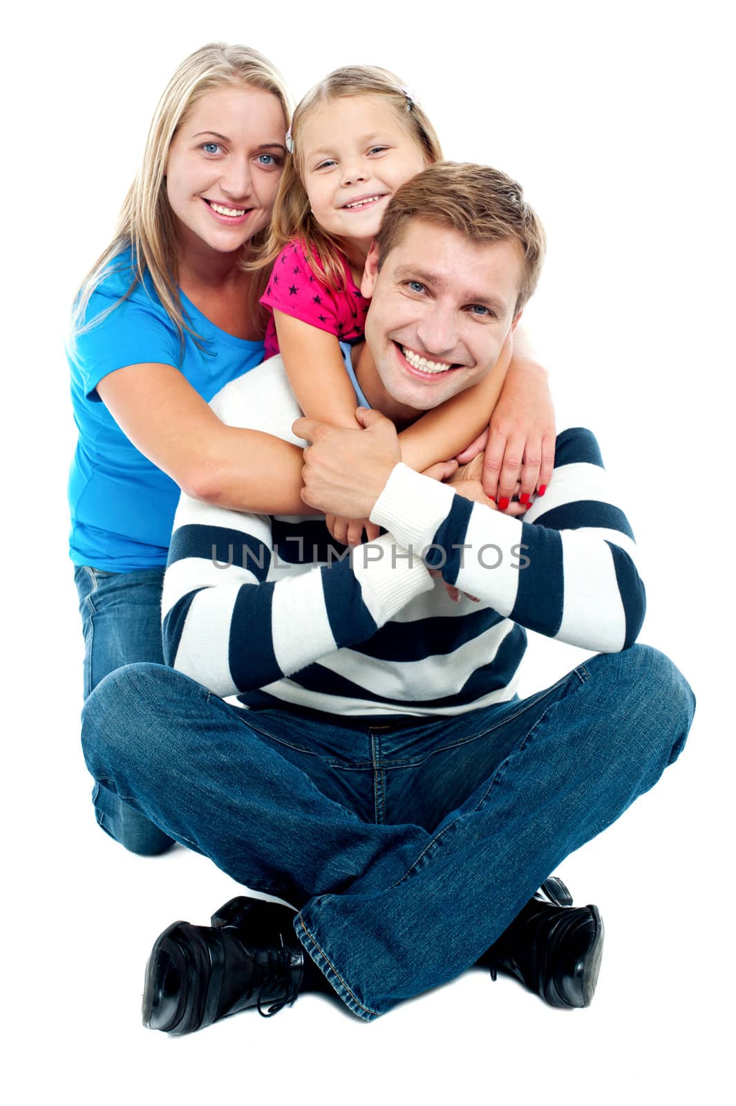 Happy young family; mother, father and their daughter isolated against white background