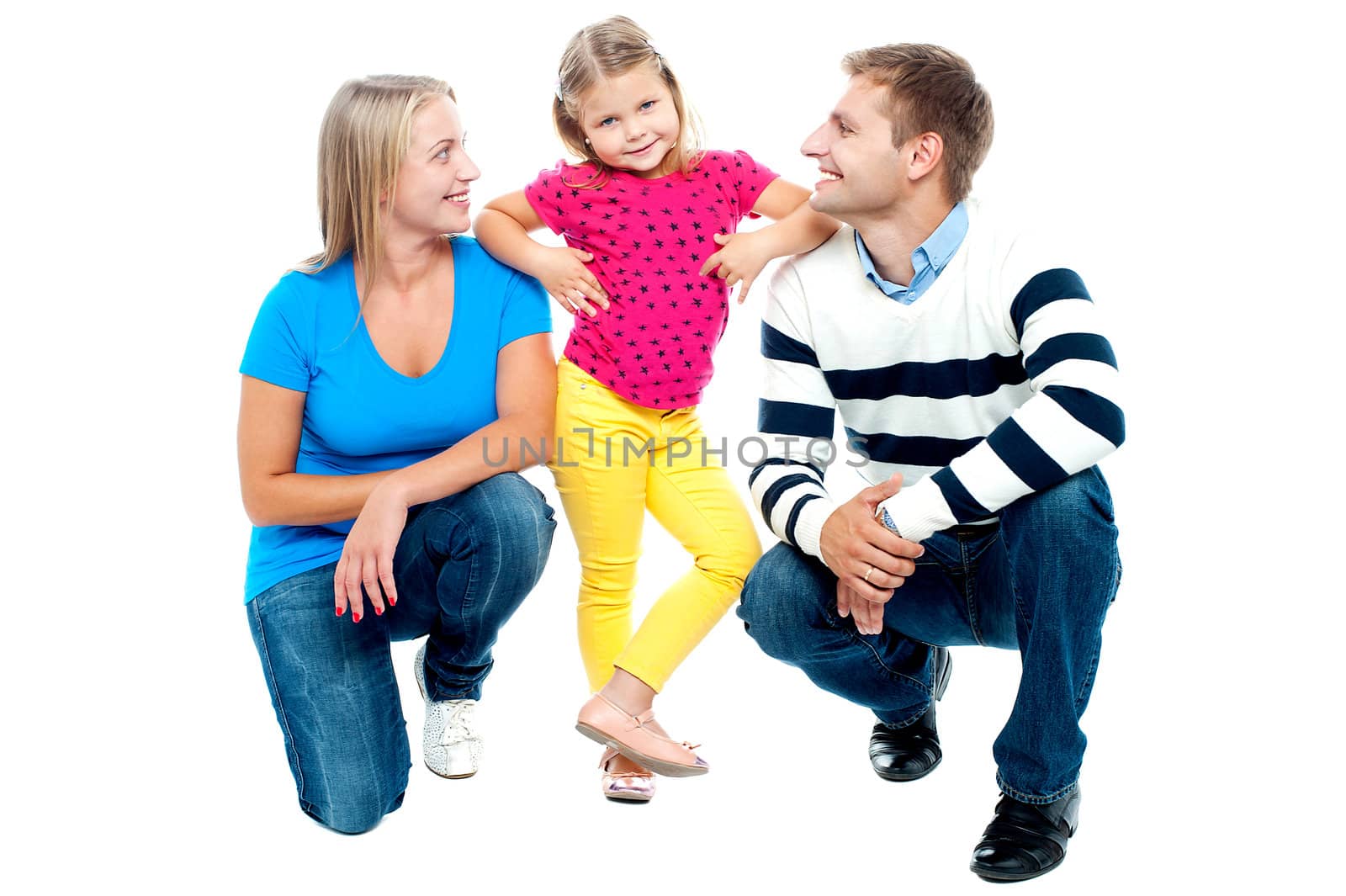 Happy family with kid together isolated on white. Parents squatting with girl child standing in the middle