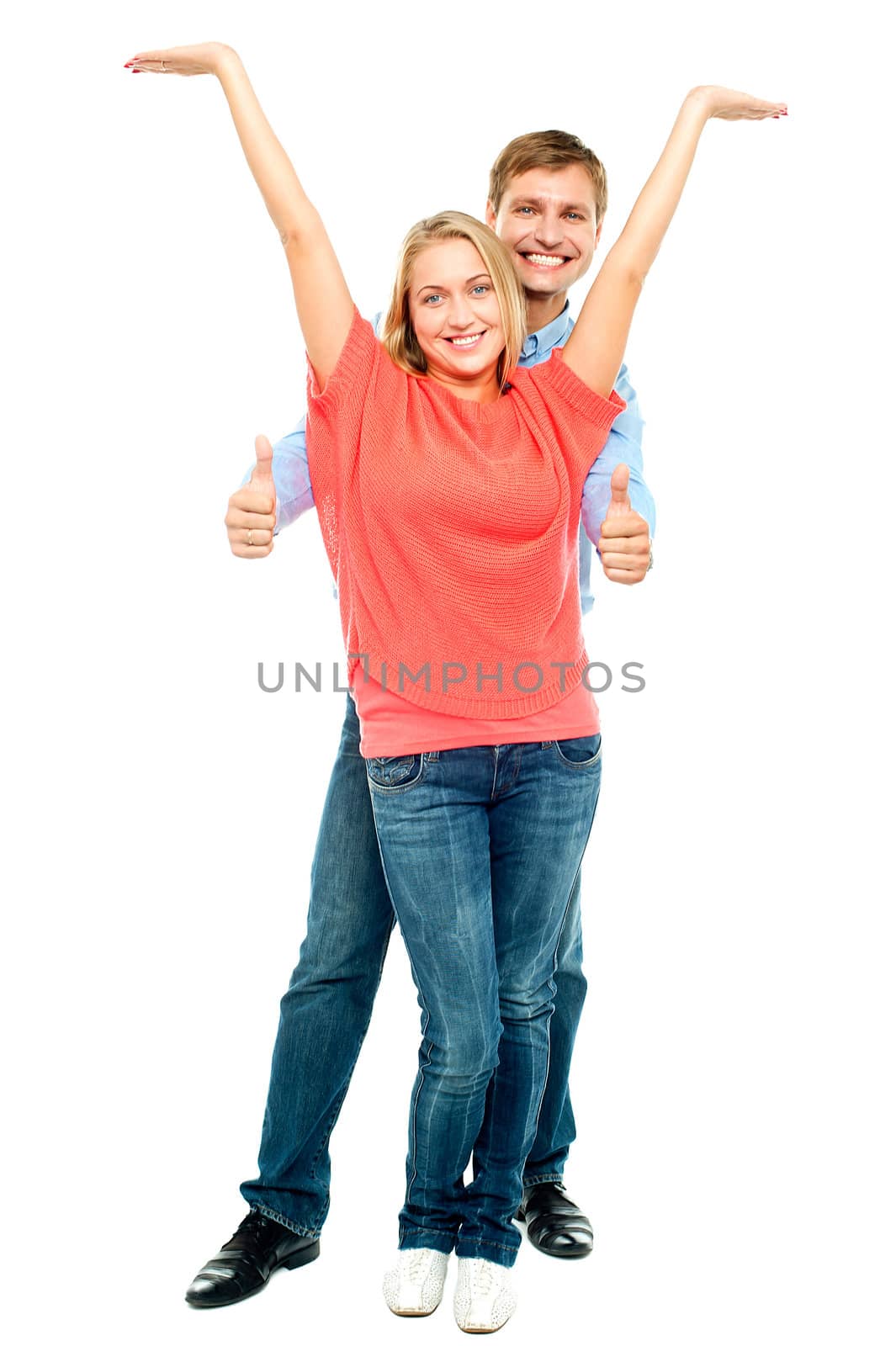 Playful couple goofing around isolated against white background