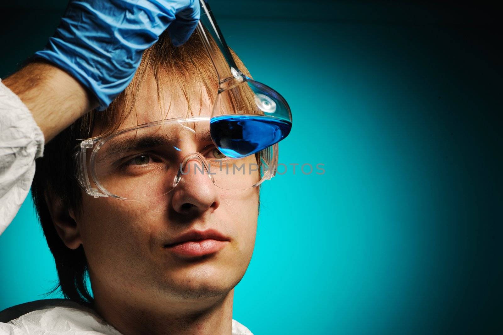 Scientist in protective wear and glasses 