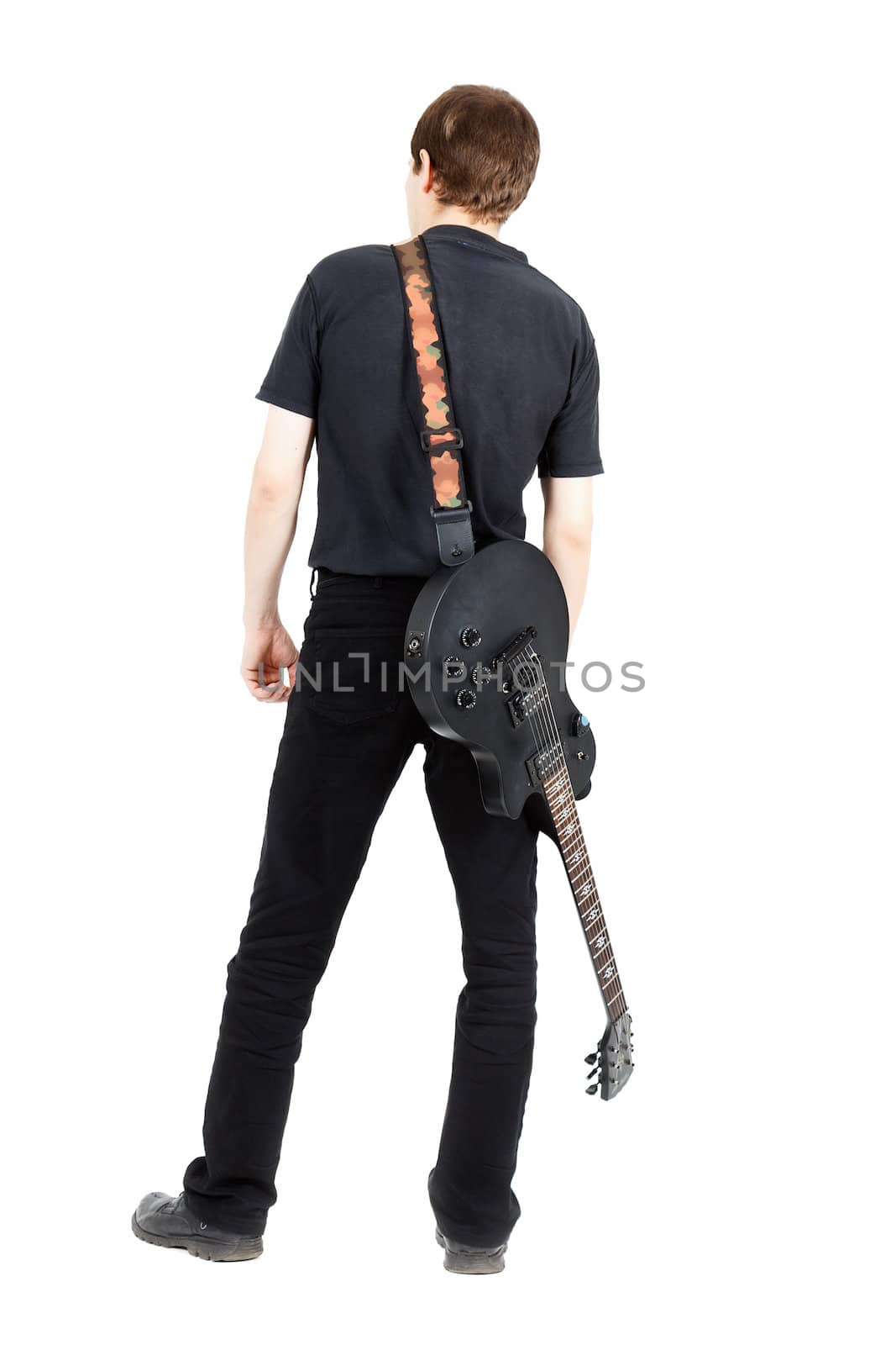 A young man with a black electric guitar isolated on white background