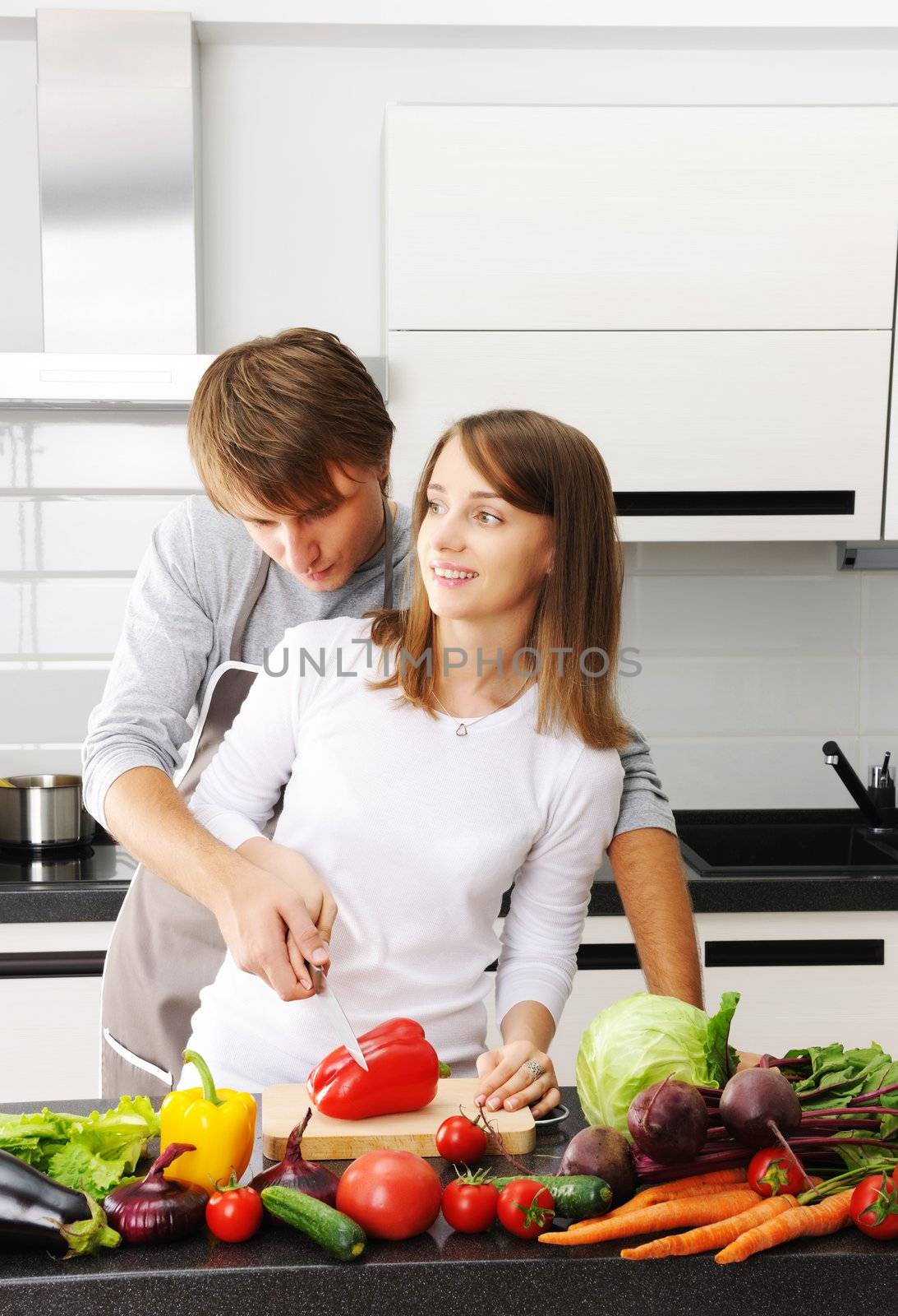 Couple cooking in modern kitchen