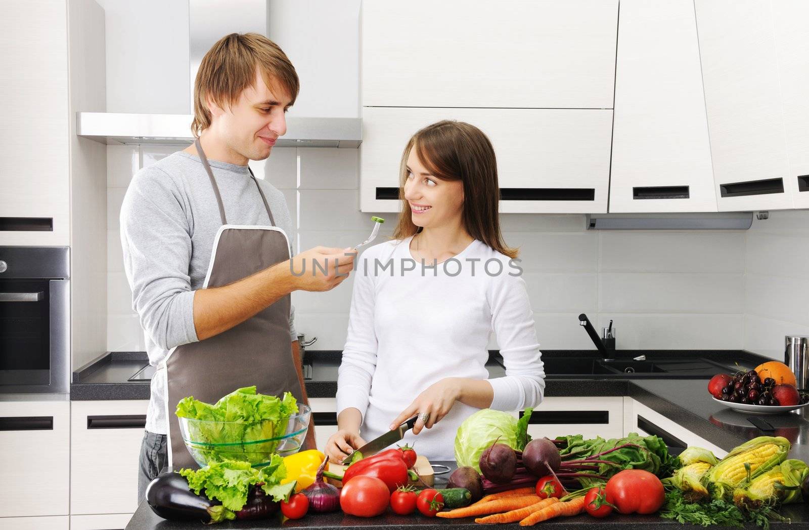 Couple cooking in modern kitchen