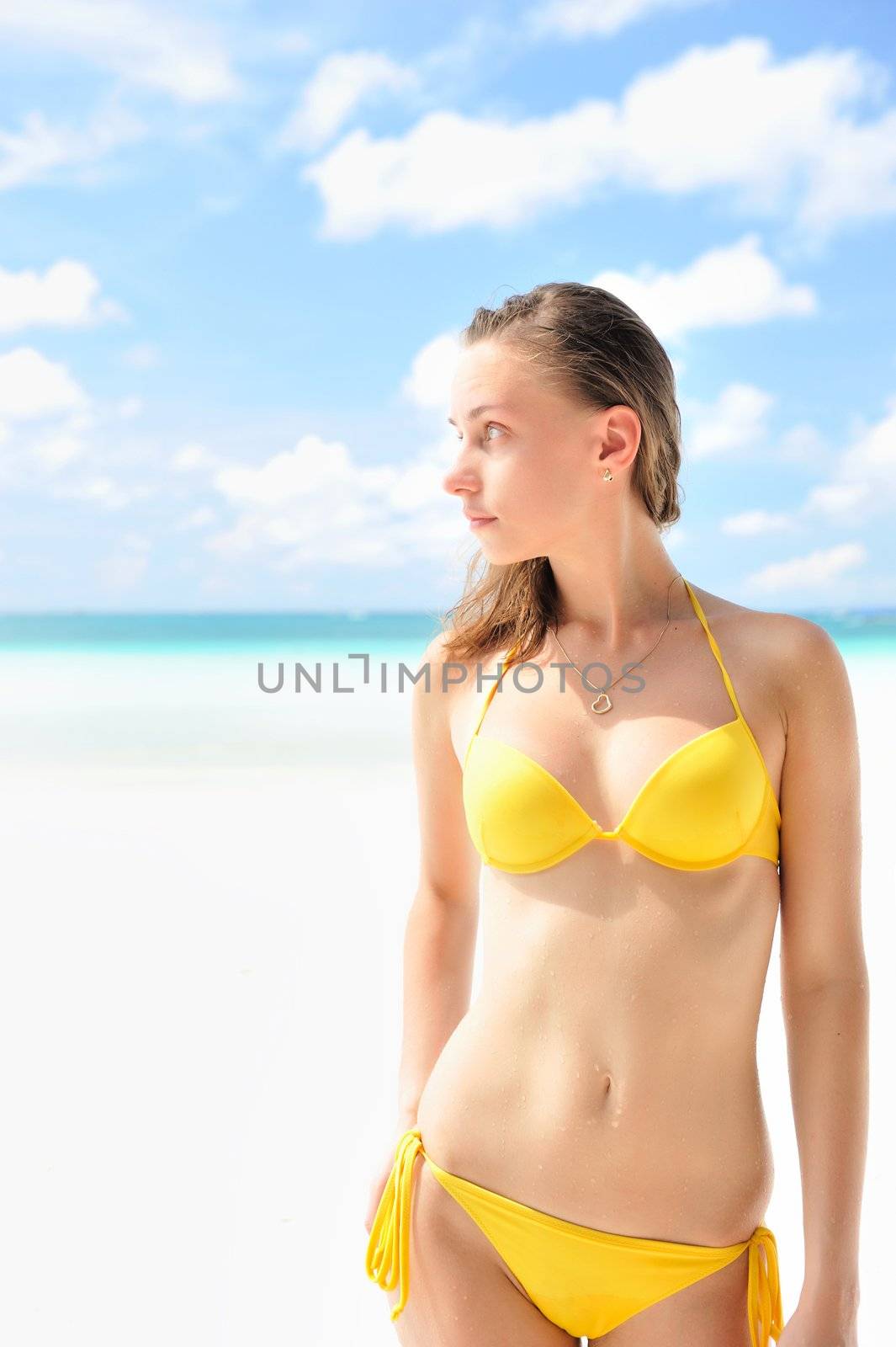 Woman with  beautiful body on a tropical beach