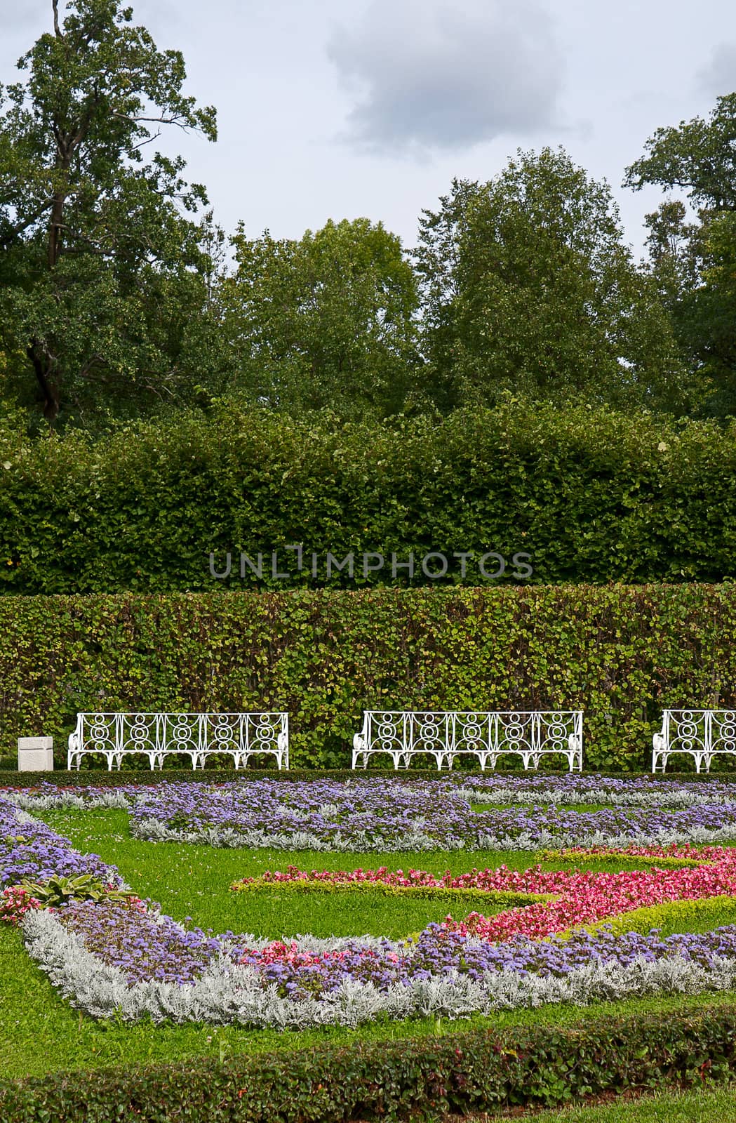 View of flower beds and benches in  Catherine Park, Tsarskoye Selo, Russia.